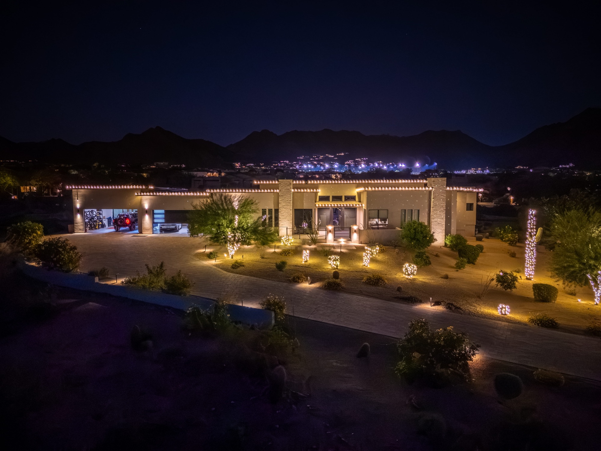 Aerial night view of a fully lit Scottsdale estate
