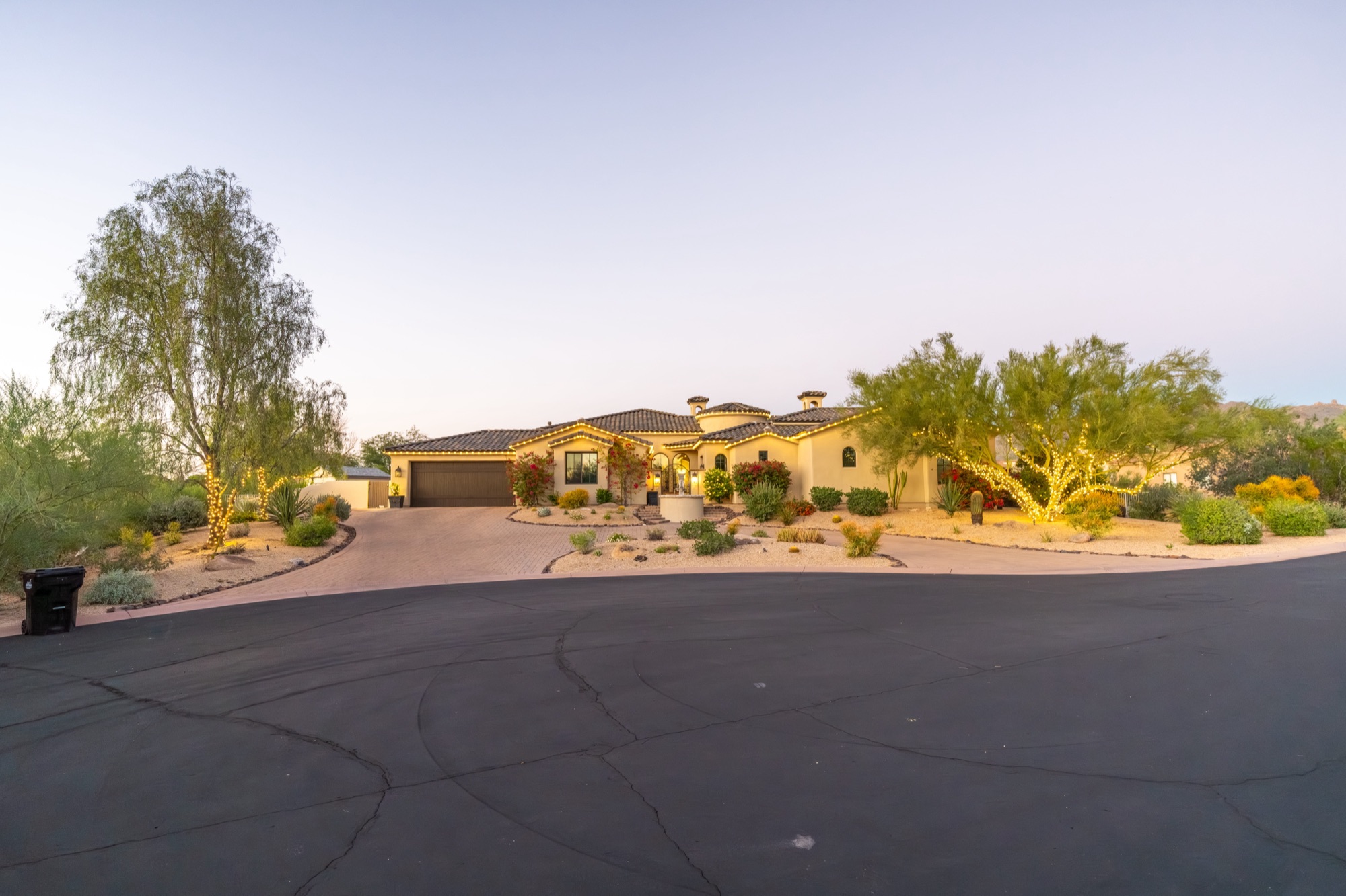 Wide dusk shot of a fully lit Scottsdale estate